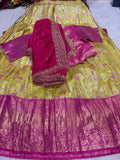 Yellow gold brocade lehenga set laid flat showing full detail