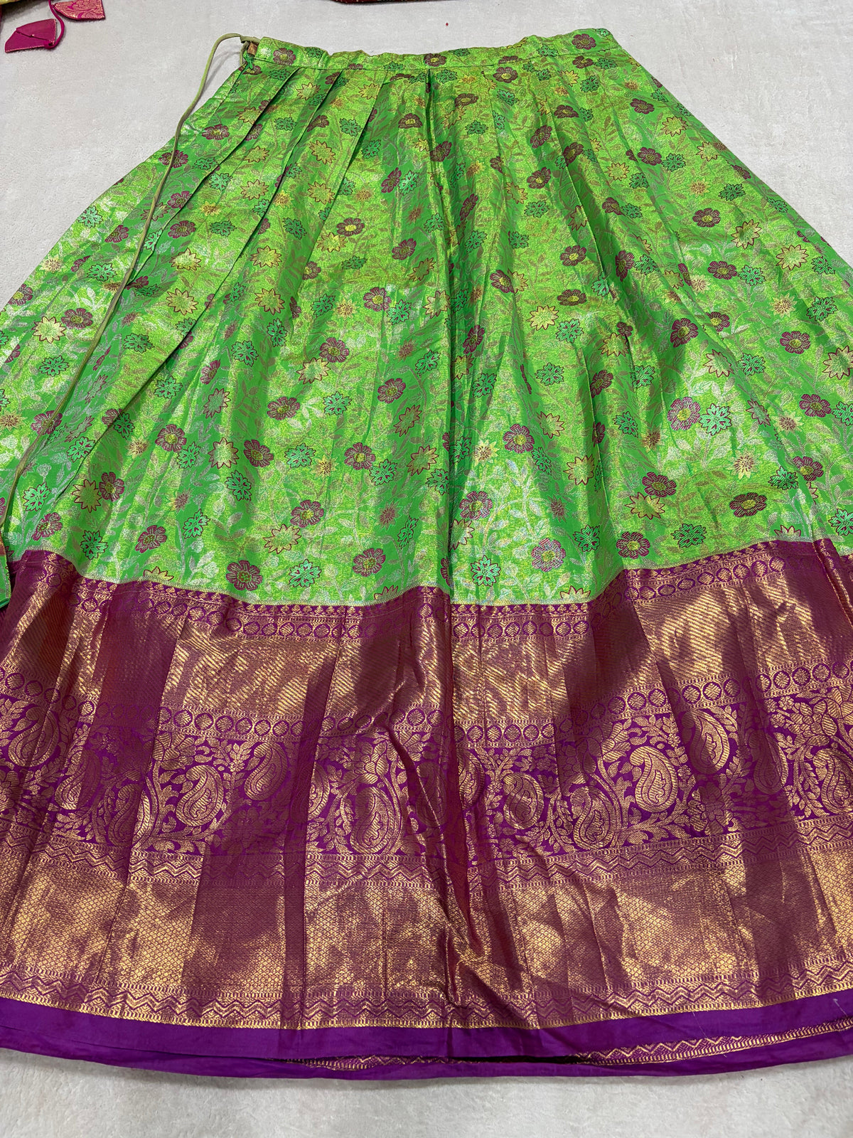 Parrot green lehenga skirt with purple zari border