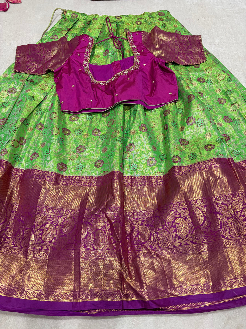 Parrot green lehenga set with purple embroidered blouse