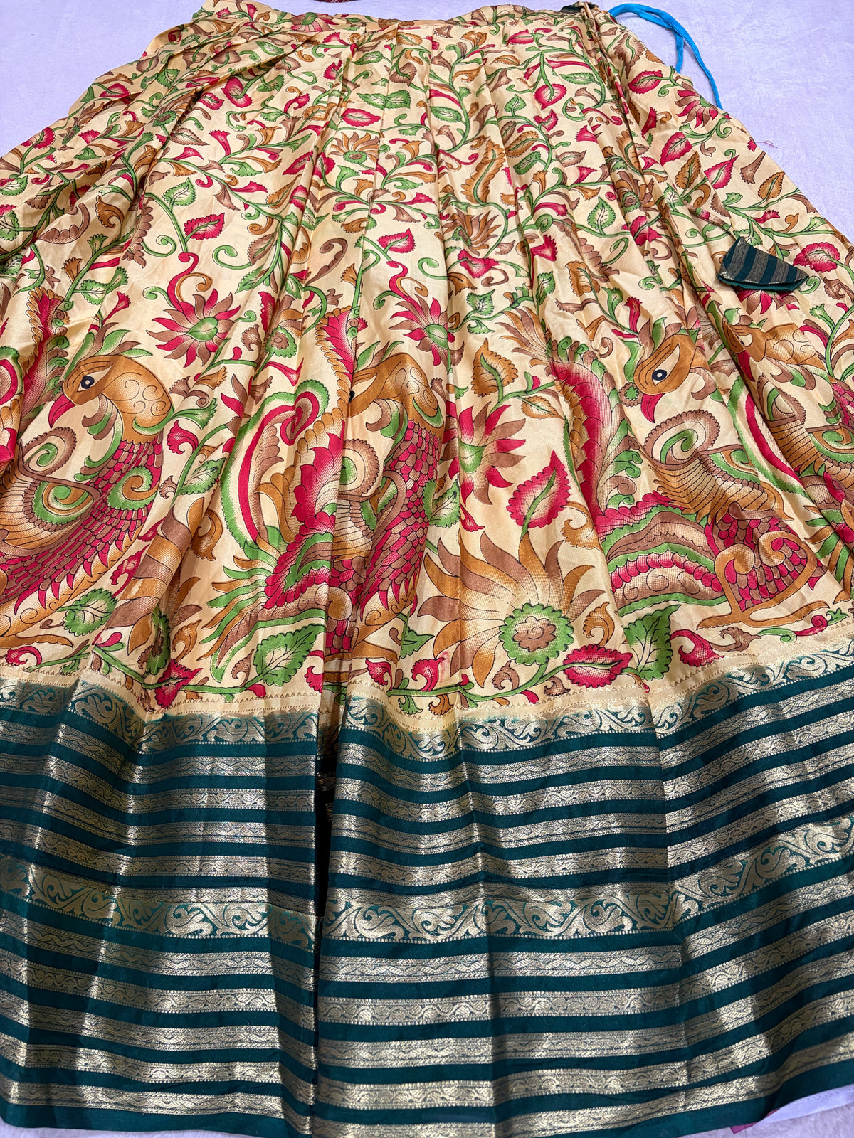 Cream Kalamkari lehenga skirt with bottle green zari border