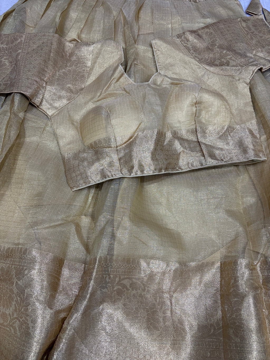 Golden tissue lehenga blouse close up detail