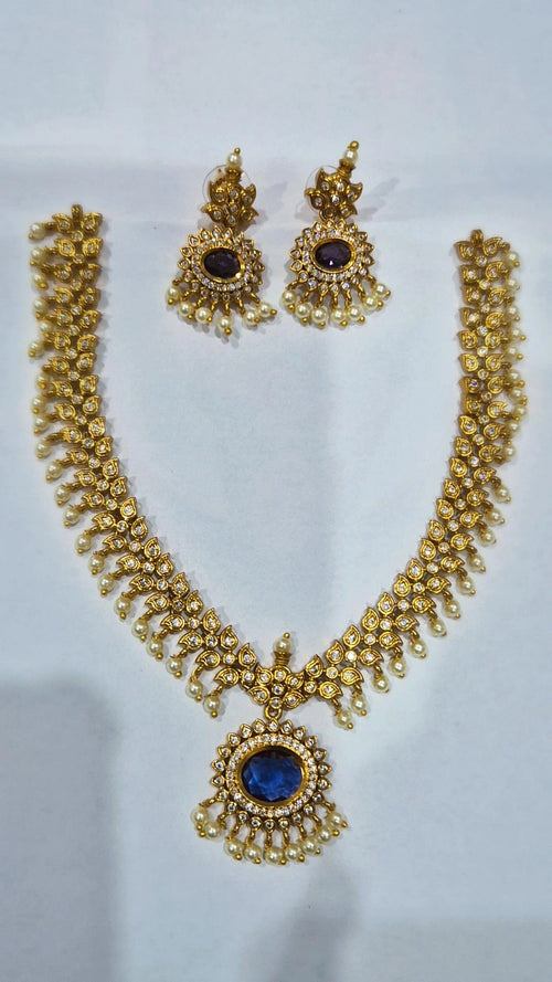 Blue sapphire antique gold kundan pearl drop necklace set with matching chandelier earrings