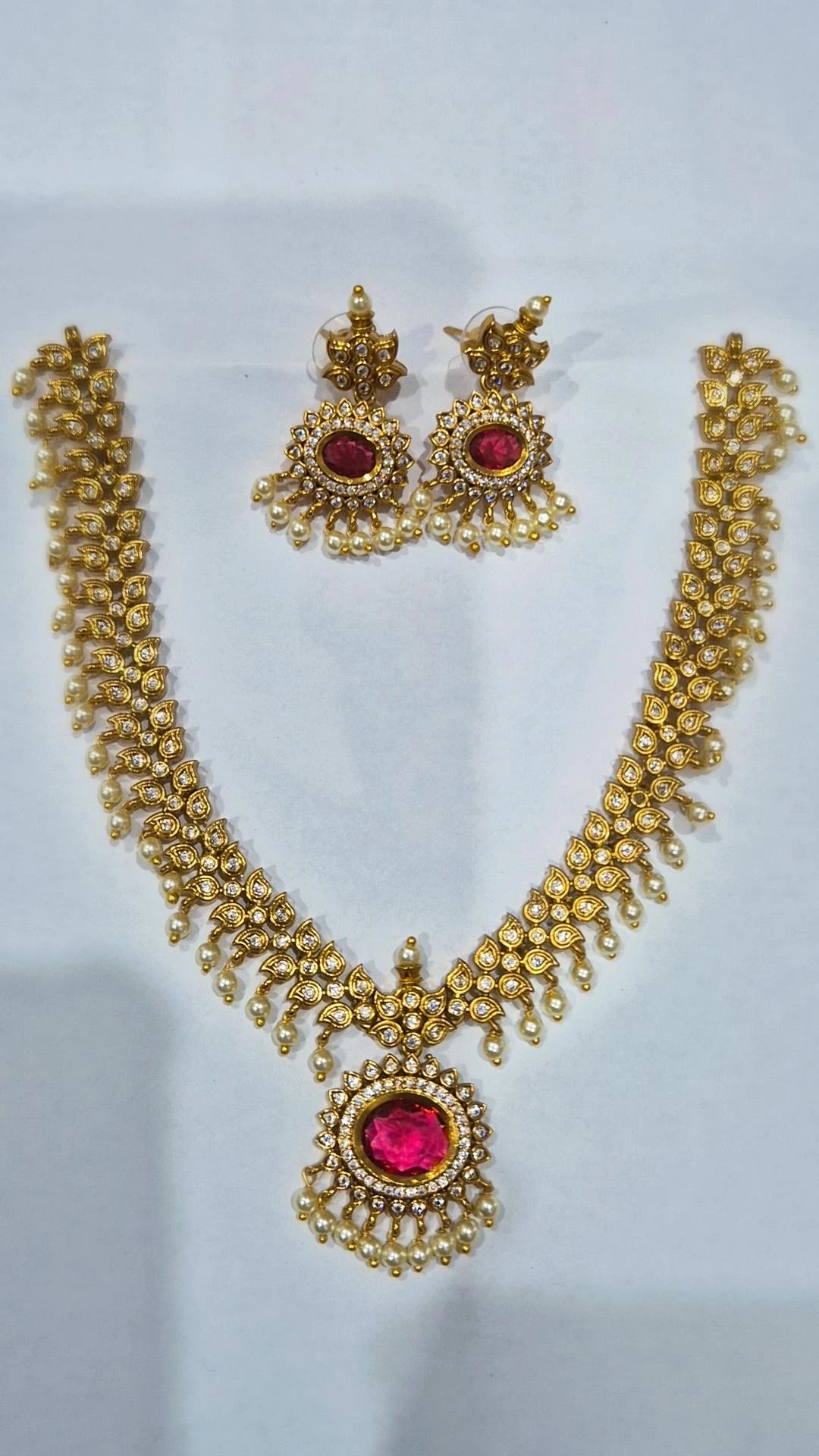 Ruby pink antique gold kundan pearl drop necklace set with matching chandelier earrings