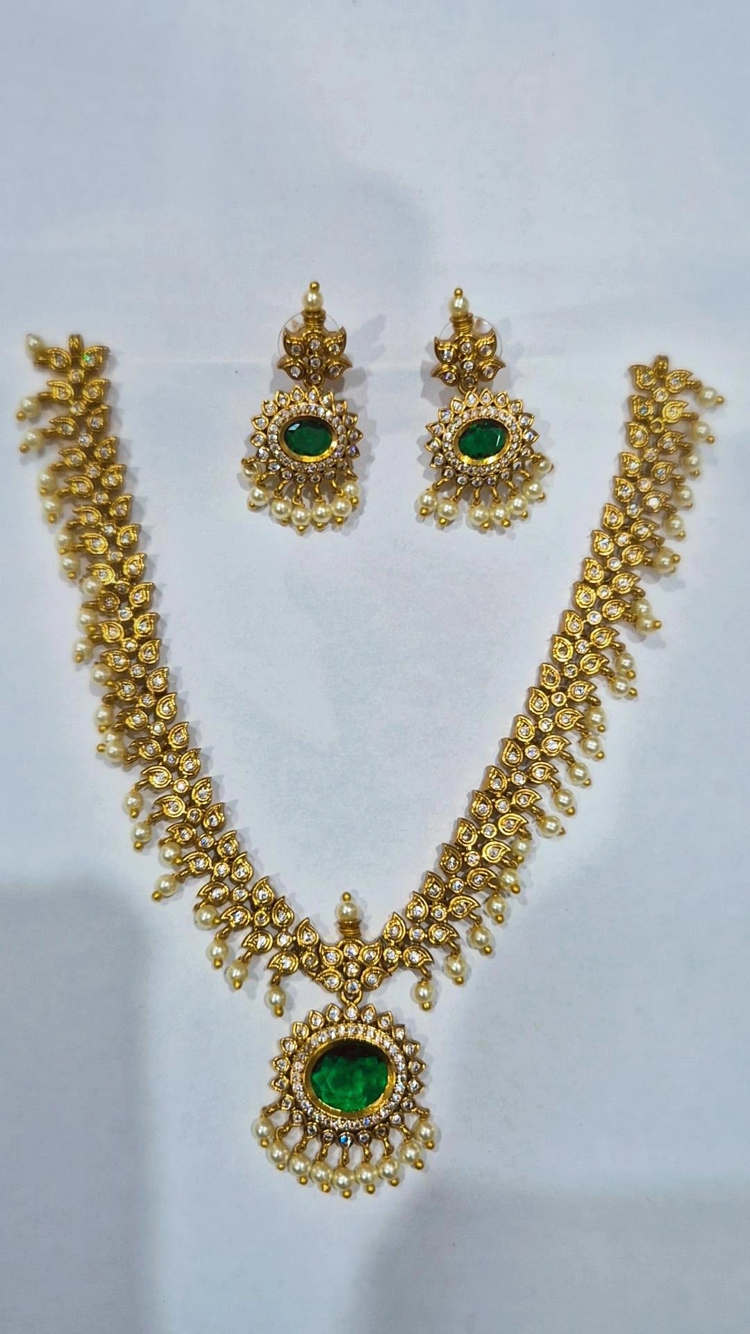 Emerald green antique gold kundan pearl drop necklace set with matching chandelier earrings