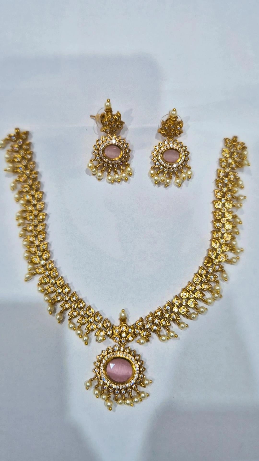 Blush pink antique gold kundan pearl drop necklace set with matching chandelier earrings