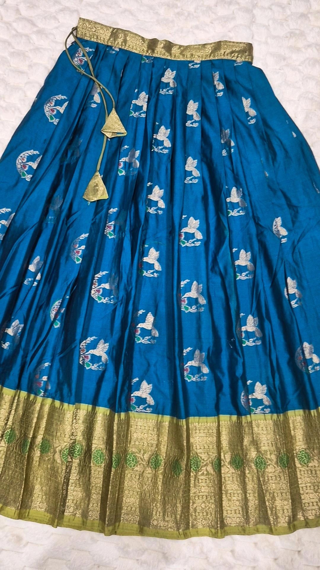Kids pattu pavada teal silk skirt with bird brocade motifs and gold zari border