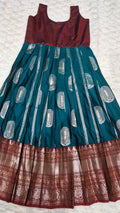 Kids pattu pavada teal silk skirt with silver brocade motifs and maroon gold zari border