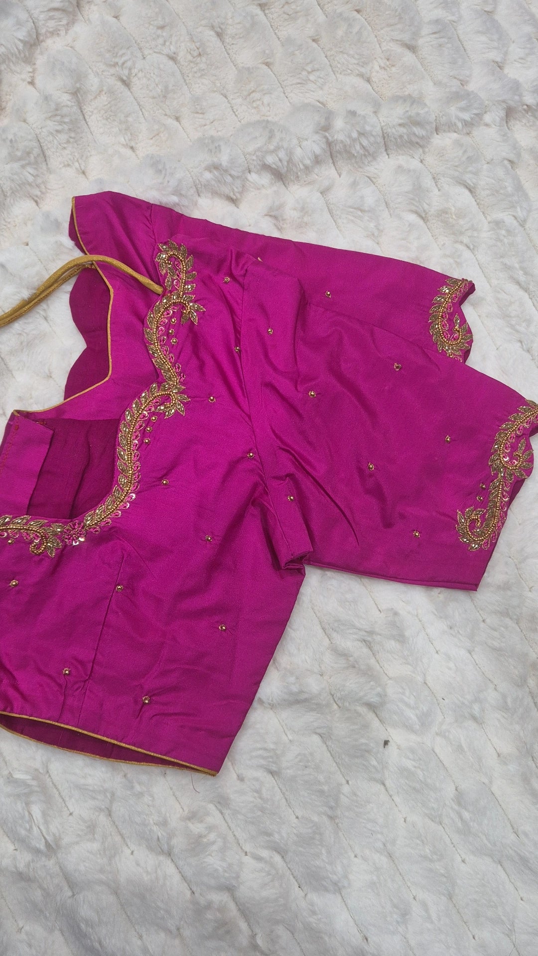 Magenta paisley scrollwork saree blouse - full view showing gold embroidery on neckline and sleeves