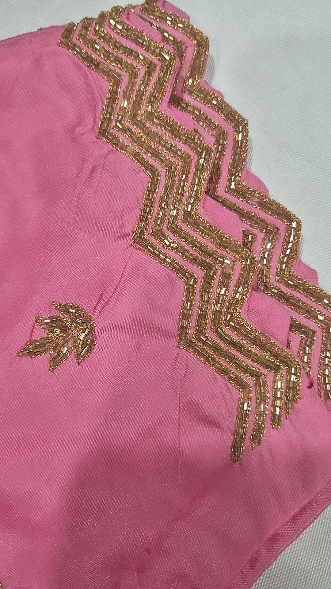 Baby pink saree blouse - close up of dramatic gold zigzag chevron neckline