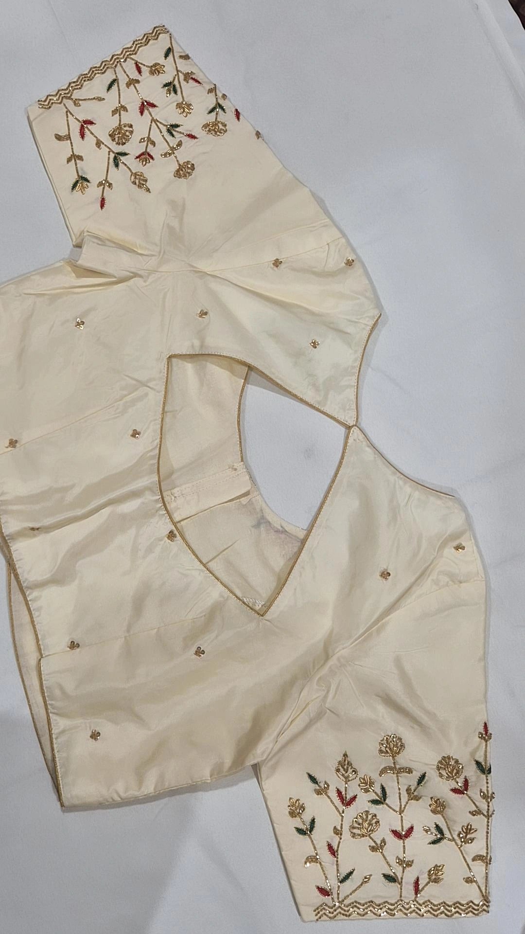 Cream floral hand work saree blouse - back view