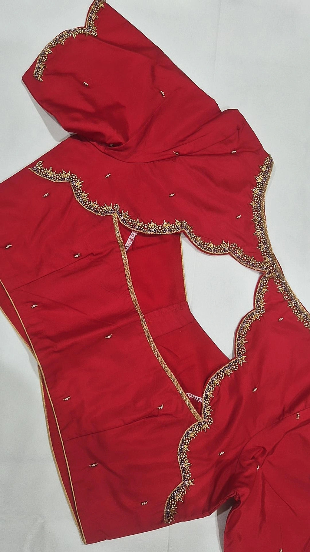 Red scalloped saree blouse - back view showing deep opening