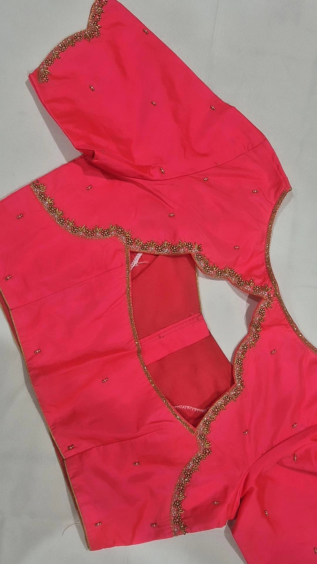 Hot pink scalloped saree blouse - back view showing deep opening