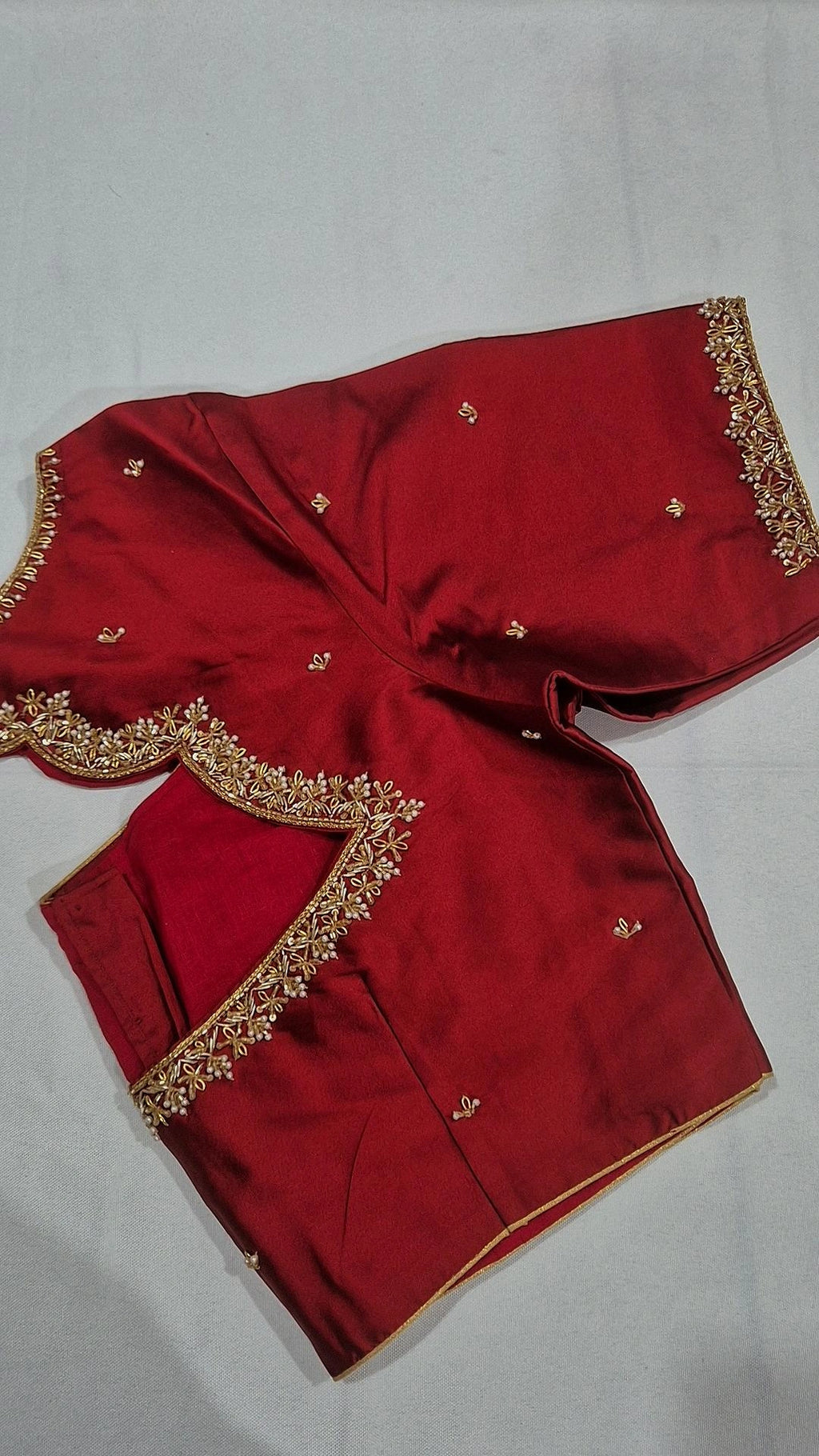 Bridal red V-back saree blouse - front view with gold floral border