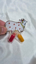 Wooden Kamdhenu cow favor with haldi and kumkum mini bottles