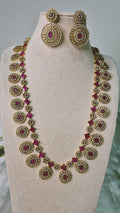 Victorian ruby long Bottu Mala necklace set with CZ pavé oval medallions and matching drop earrings on jewellery bust