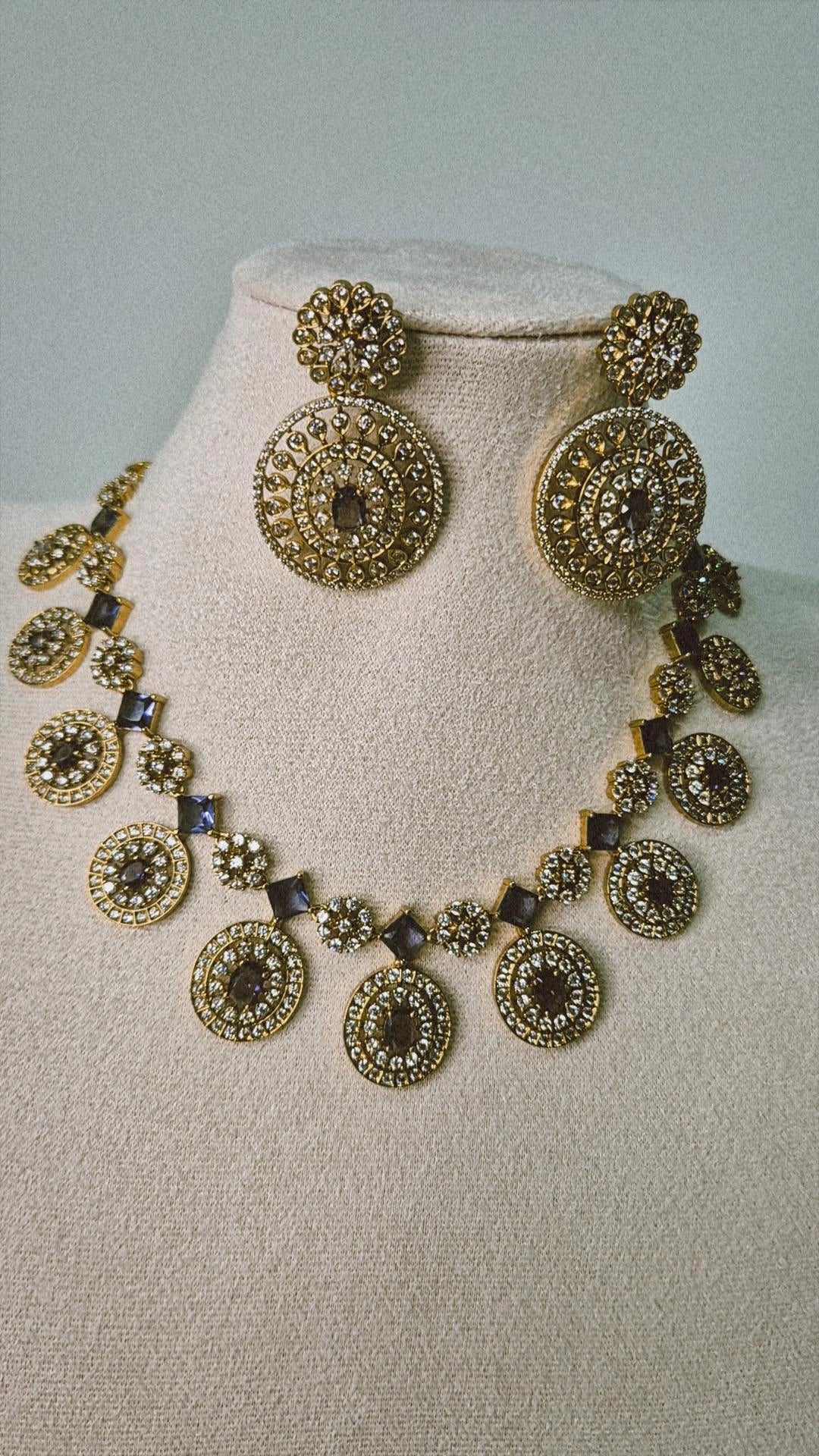 Victorian antique gold CZ medallion Bottu Mala necklace with sapphire square links and oversized drop earrings on jewellery bust