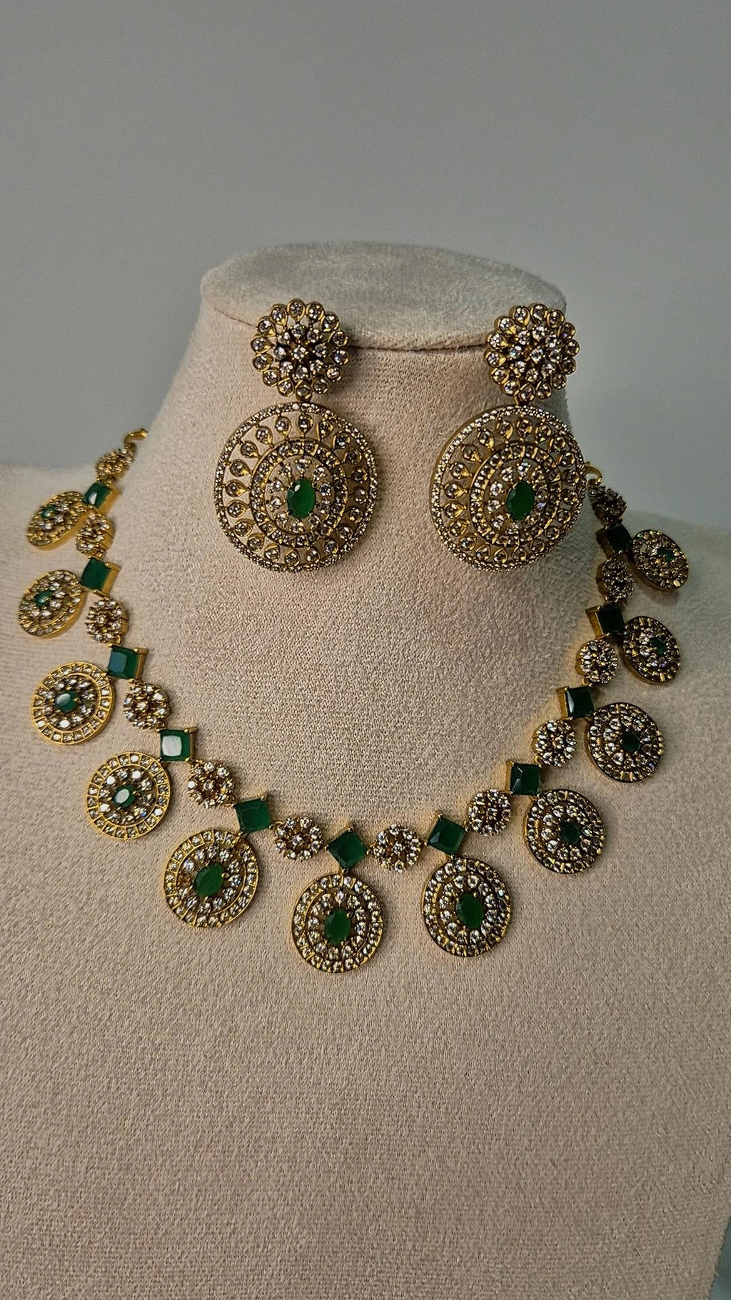 Victorian antique gold CZ medallion Bottu Mala necklace with emerald square links and oversized drop earrings on jewellery bust