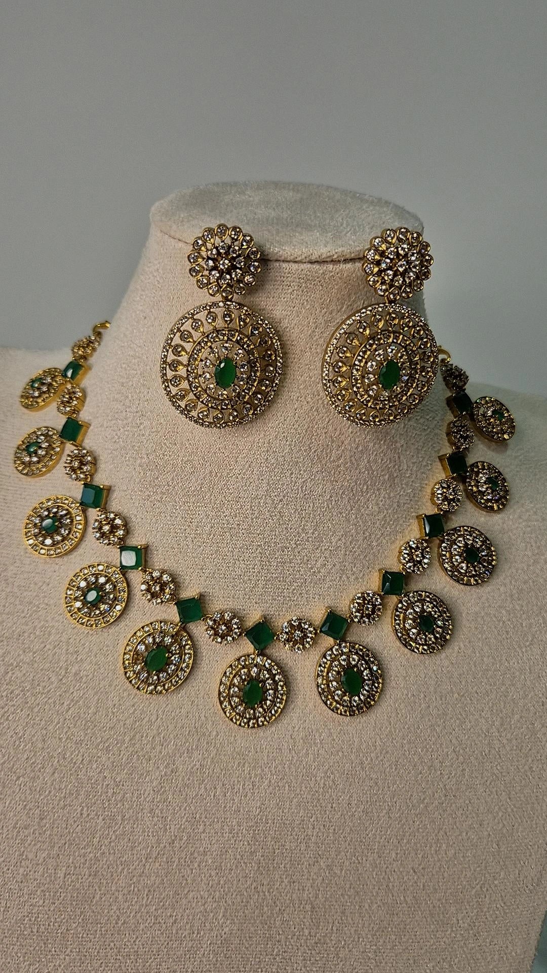 Victorian antique gold CZ medallion Bottu Mala necklace with emerald square links and oversized drop earrings on jewellery bust