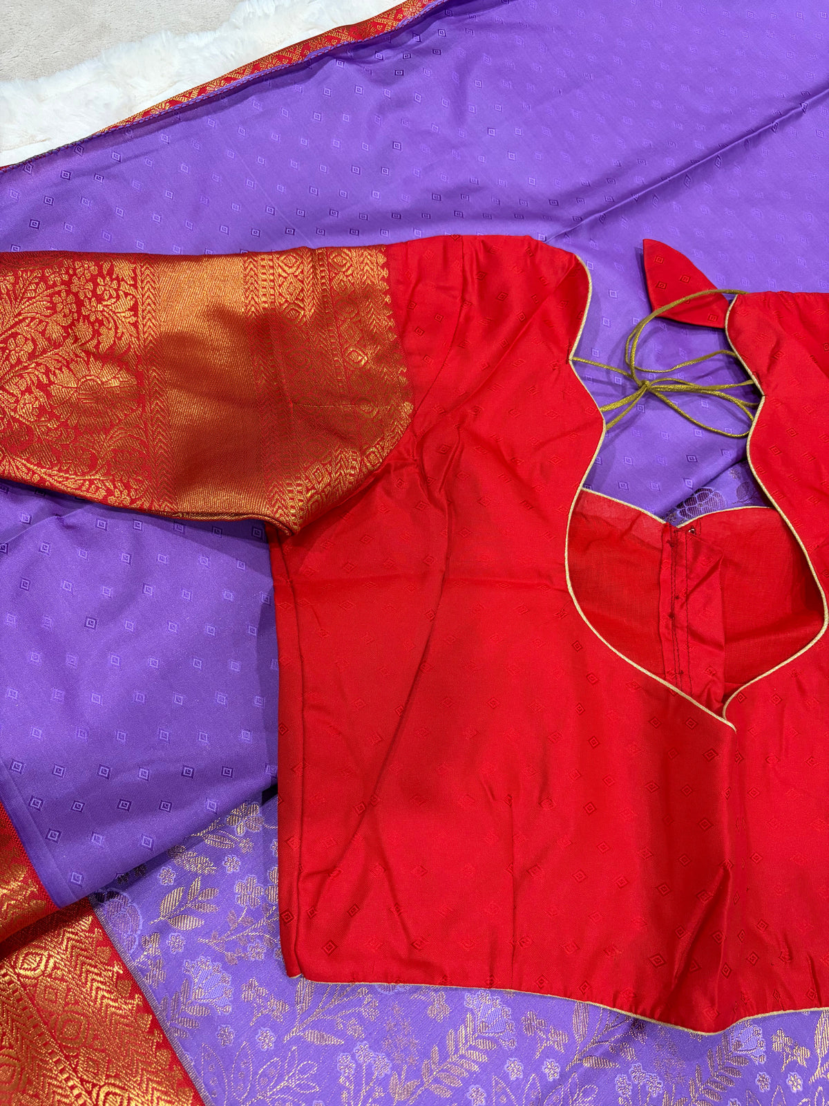 Red stitched blouse with Kanjivaram zari sleeves and sweetheart back neckline