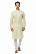 Men's yellow chikankari kurta with white embroidery and white pant set