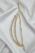 Gold Pearl Beaded Ear Chain on White Satin