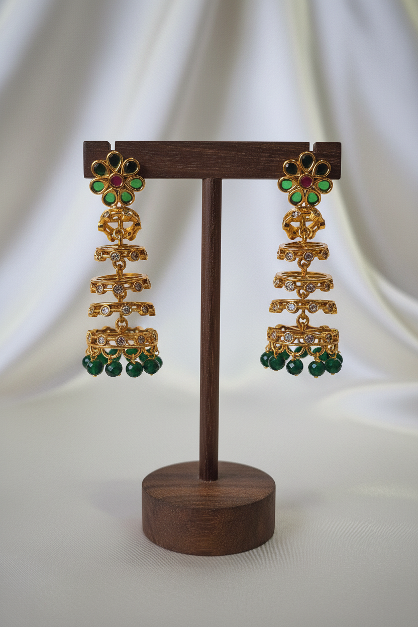 Gold Green Ruby Jhumka Earrings - dark brown stand