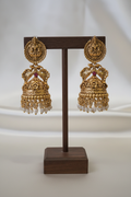Gold Antique Lakshmi Peacock Jhumka - dark brown stand