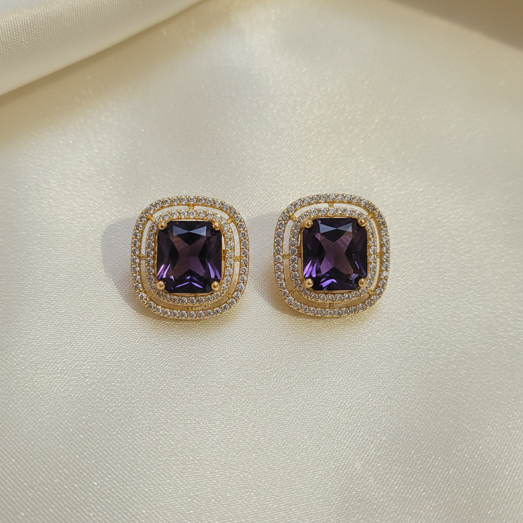 Gold Dark Purple CZ Cushion Studs - cream flat lay