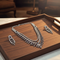 Black silver diamond necklace set on wooden tray