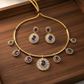 Gold hasli purple oval choker set on wooden tray
