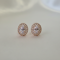 Rose Gold Sunburst CZ Studs - cream flat lay