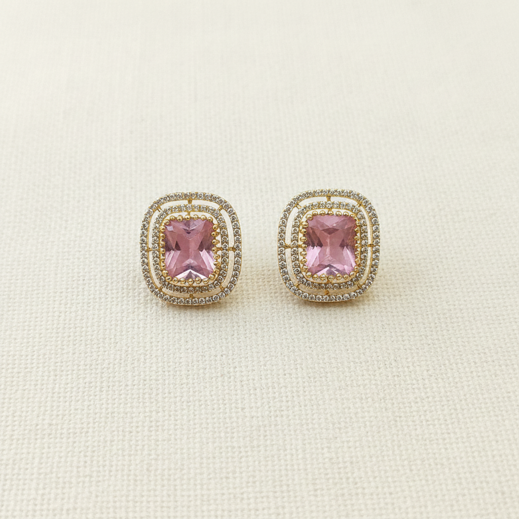 Gold Baby Pink CZ Cushion Studs - cream flat lay